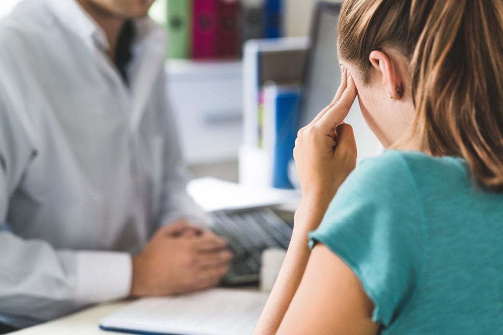 a doctor talks to a patient about salvia