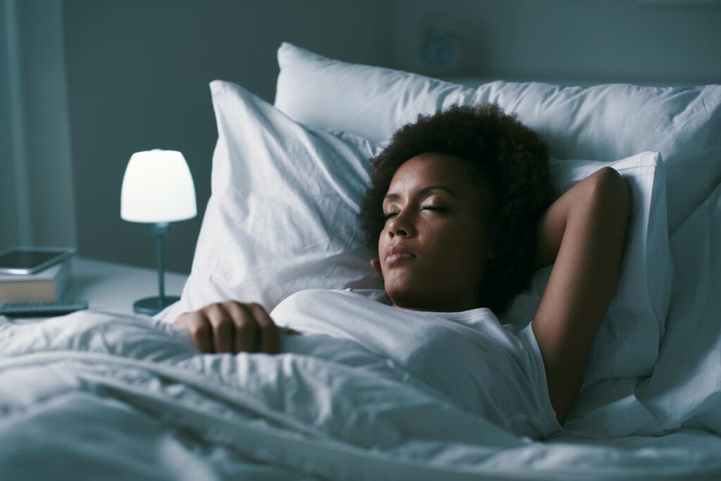 woman laying in bed thinking about ambien abuse and withdrawal