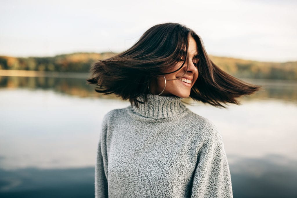 a woman shakes her head as she thinks about the benefits of a trauma recovery program