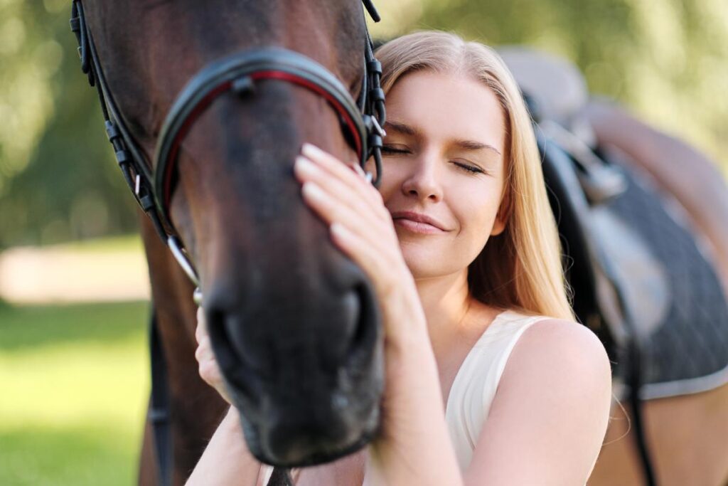Woman considers the benefits of equine therapy