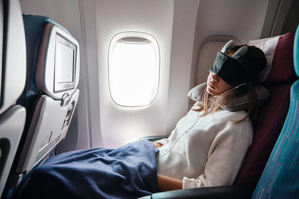 a woman struggles with sleeping pill abuse on airplanes