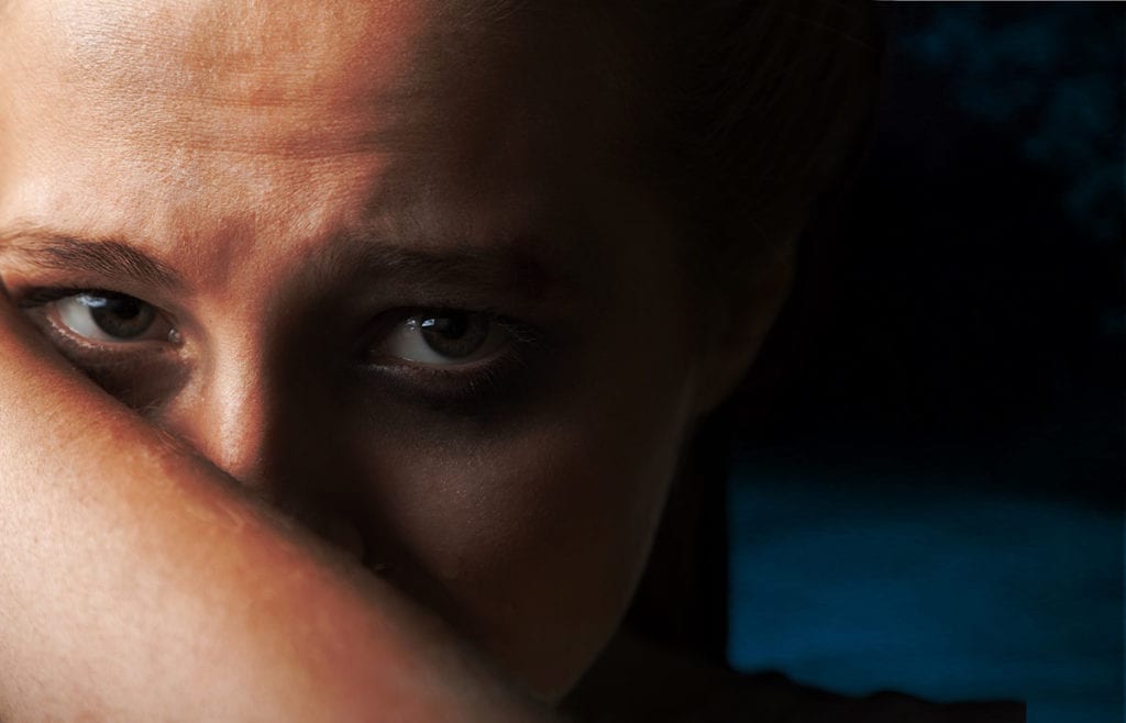 close up of eyes contemplating the warning signs of addiction