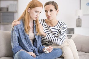 mother comforts crying teen that needs a schizotypal personality disorder treatment program