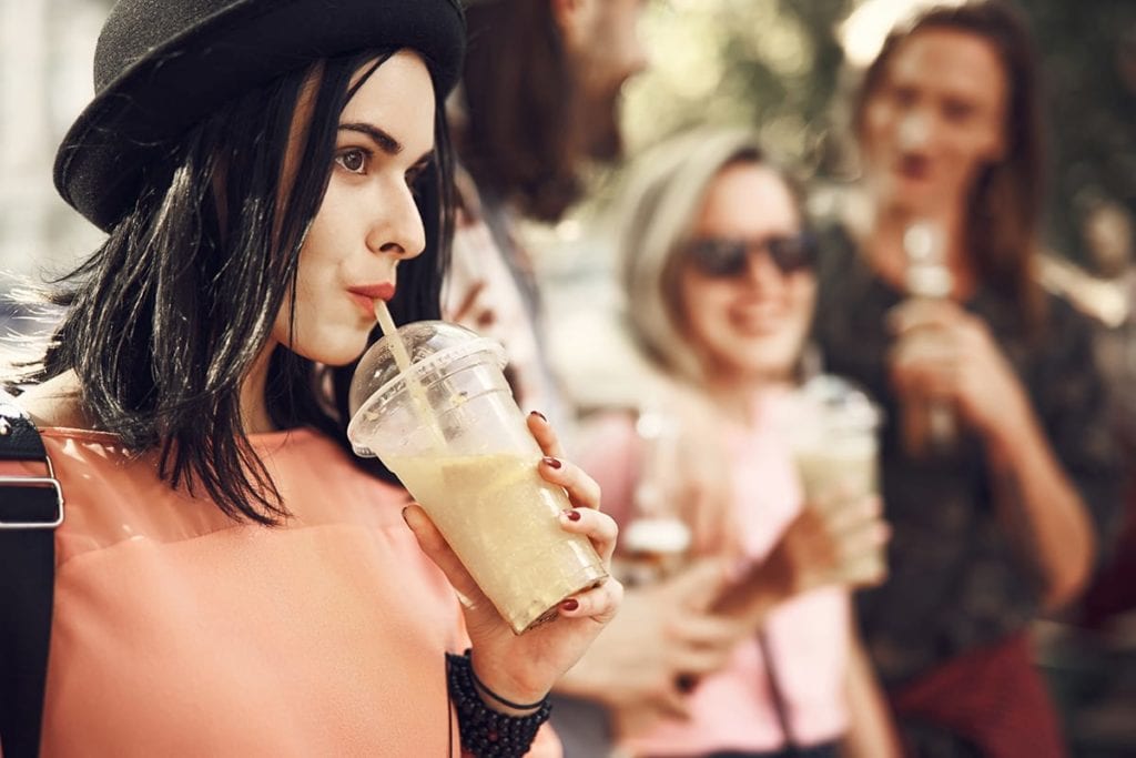 group of girls drink coffee while enjoying fun sober activities