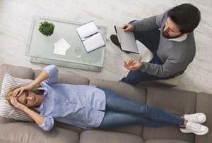 woman lying on couch in therapy at the anorexia treatment center