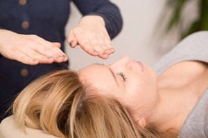 Woman uses massage as part of her holistic therapy treatment