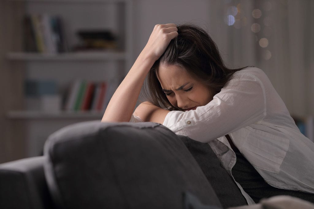 woman crying and struggling with the long term effects of meth