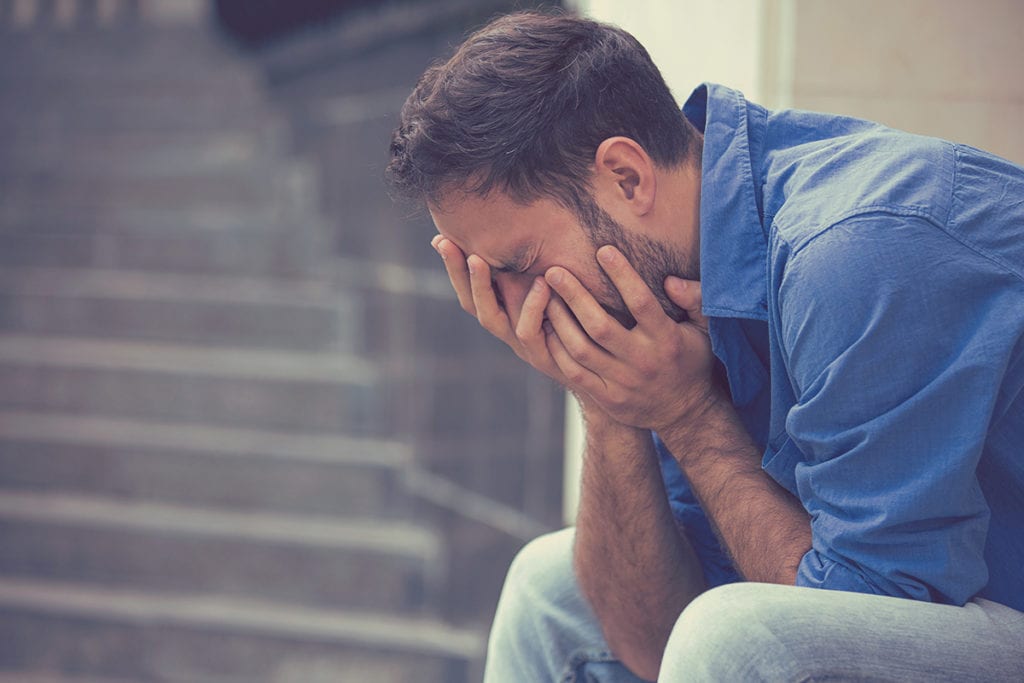 man experiencing the different stages of withdrawal