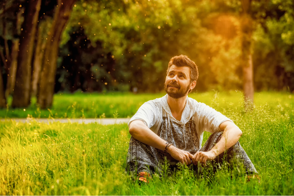 Man sitting in grass with growth mindset