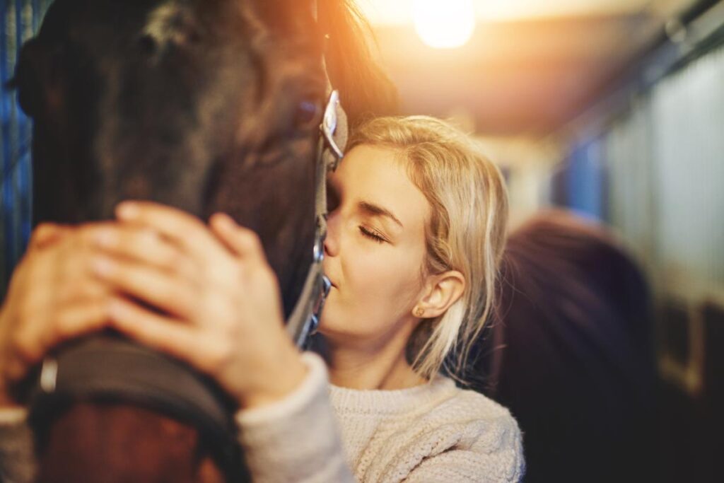 Woman learning how horses help addiction recovery