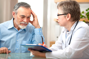 Man with alcoholism problems inquires his doctor about dementia