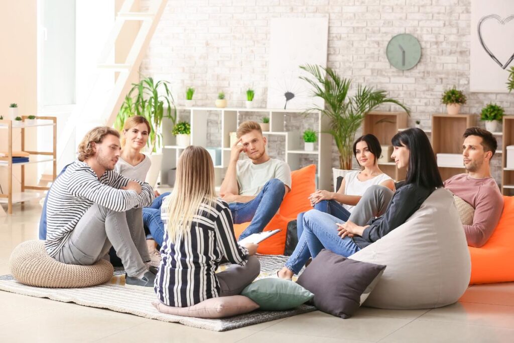 group on beanbags in a bright room discuss the chance of relapse