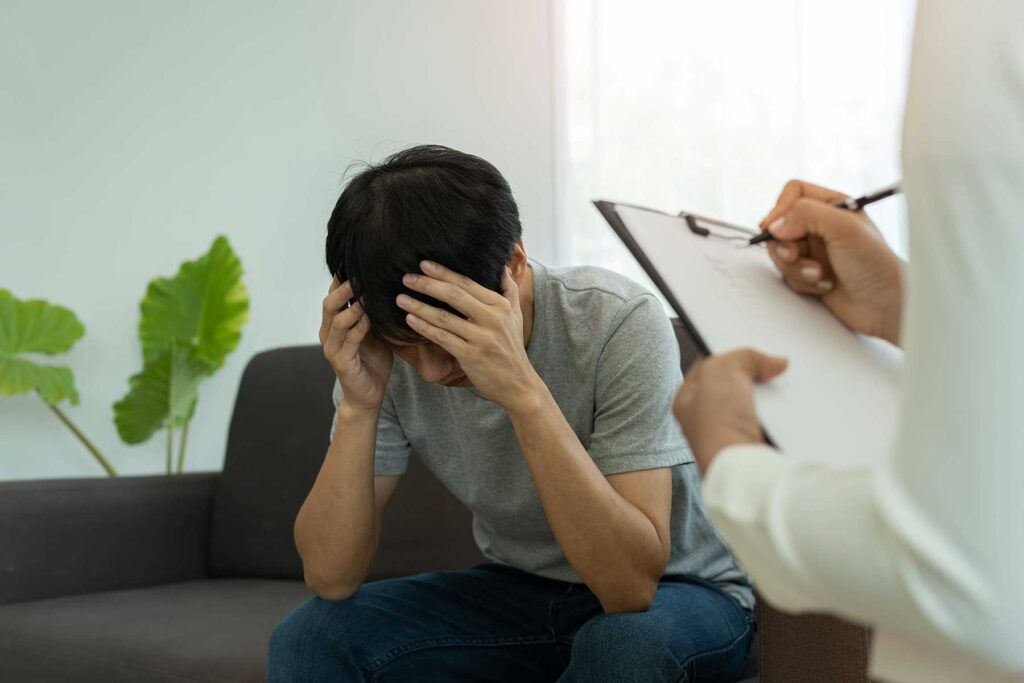 Man in treatment struggling with reasons why men relapse