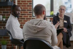 People talking at an opioid addiction treatment center