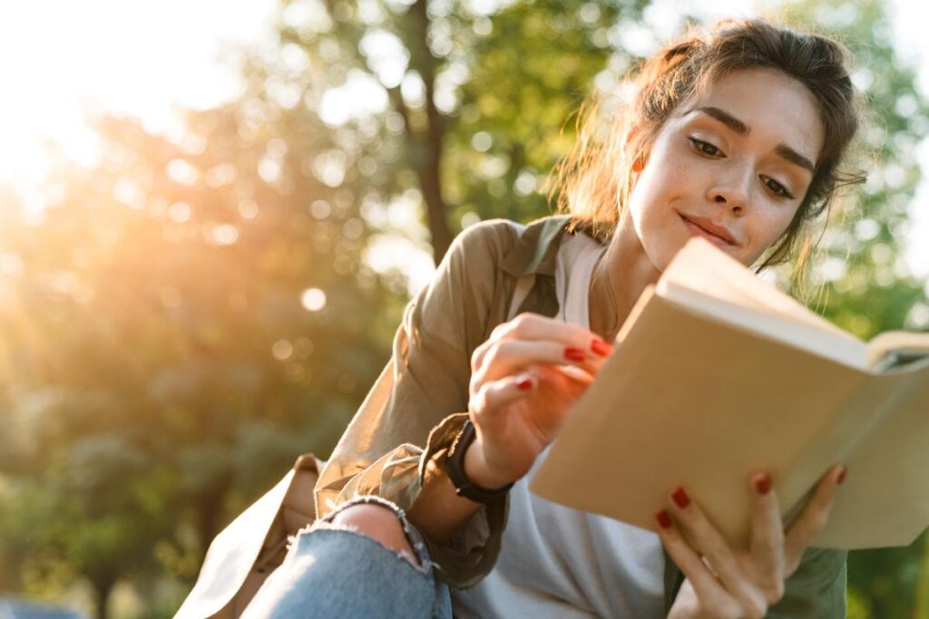 Woman reading a book, one of many fun sober activities