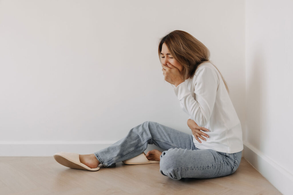 Woman wondering, "What is cannabis hyperemesis?" syndrome