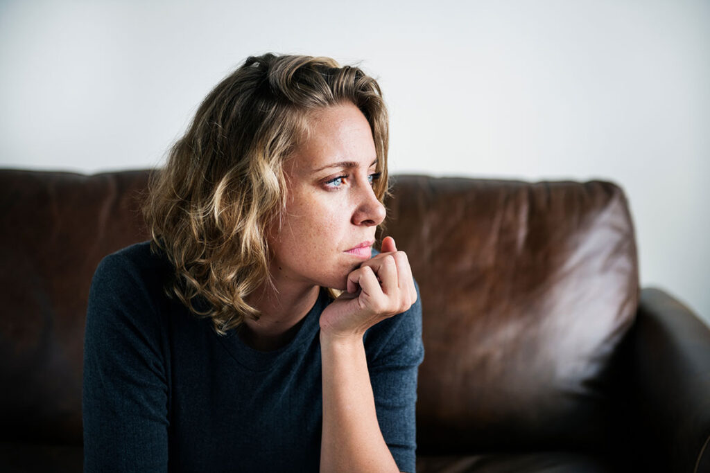 A woman contemplates the phrase "meth drinker"