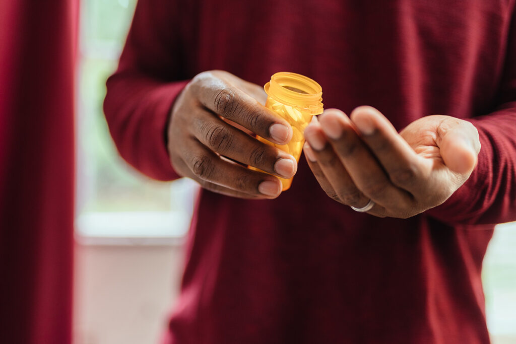 A man taking pills and wondering, "What Is laxative abuse?"