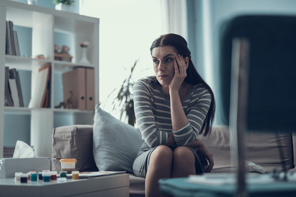 A woman wondering, "What is sudden onset alcohol intolerance?"