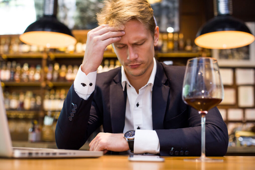 A man wondering, "What is sudden onset alcohol intolerance?"