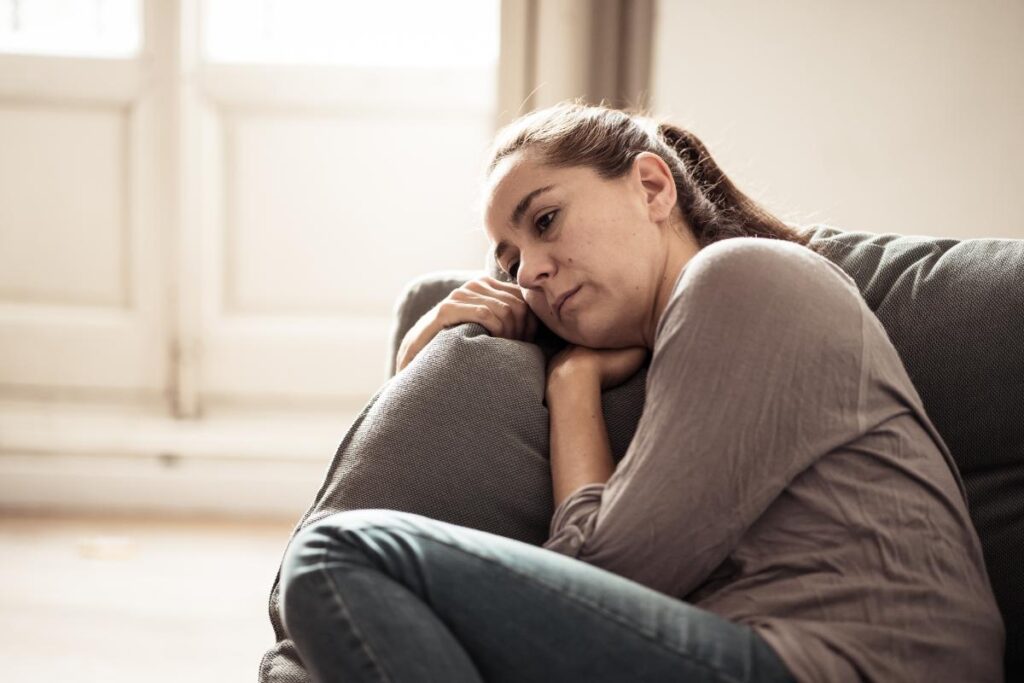 A woman wondering, "How does stress affect the body?"