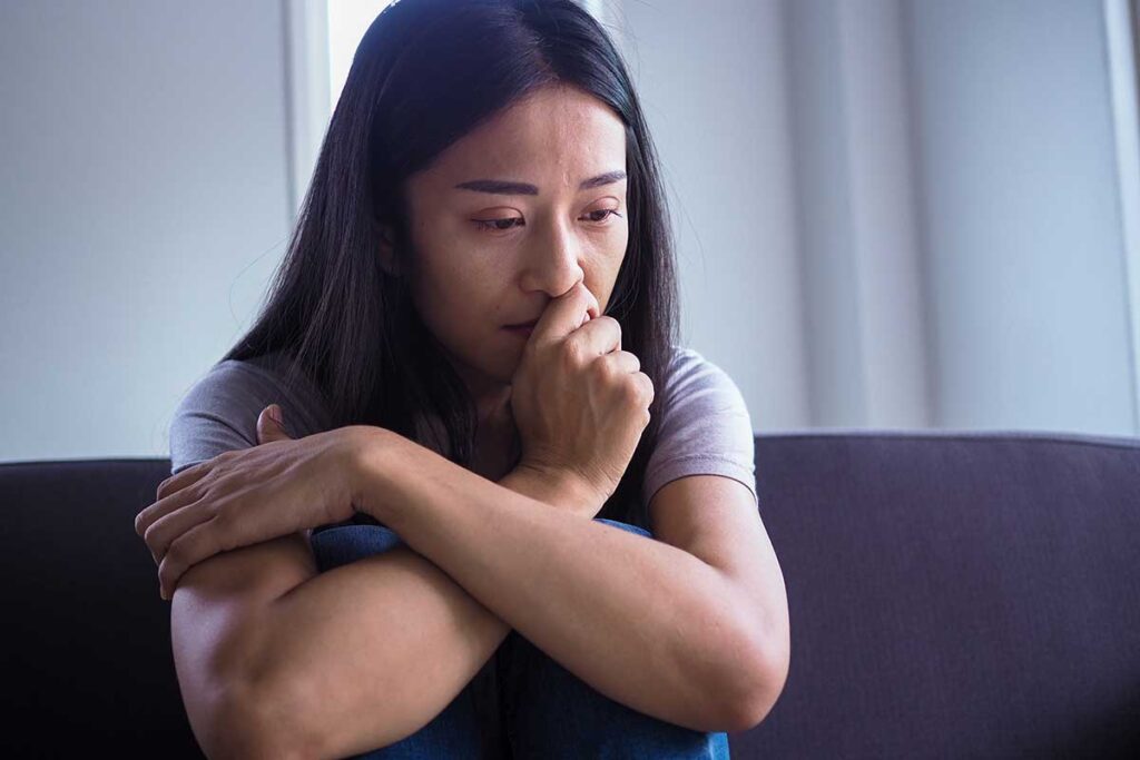 A woman dealing with alcohol withdrawal symptoms