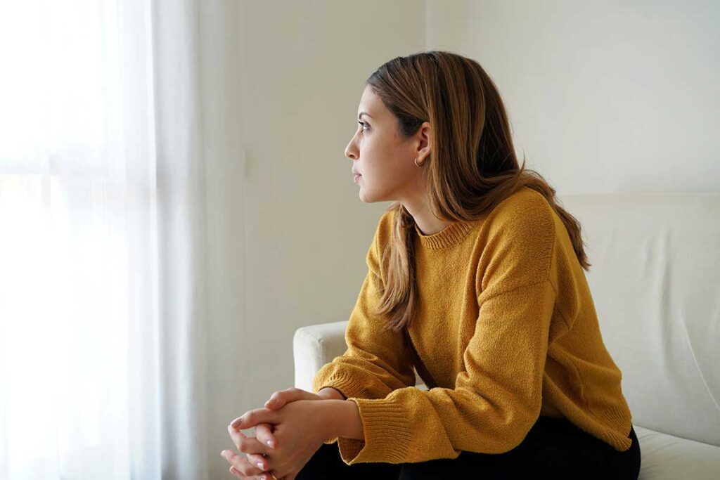 A woman wondering, "What causes sex addiction?"