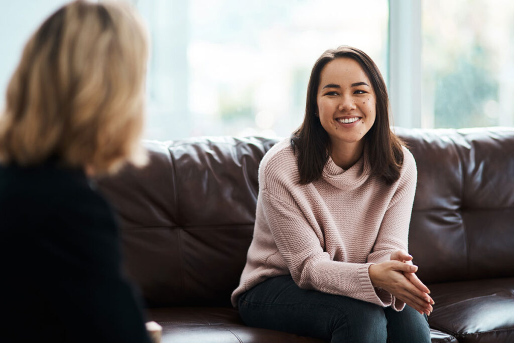 A woman learning about a rehab center for women