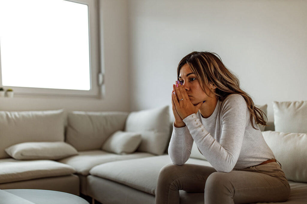 A woman thinking about the signs of high-functioning depression